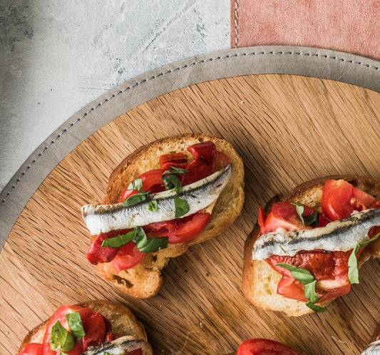 Tomato, and white anchovy bruschetta with basil and EVOO